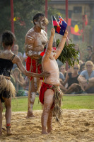 Boy holding Aboriginal and Australian flags